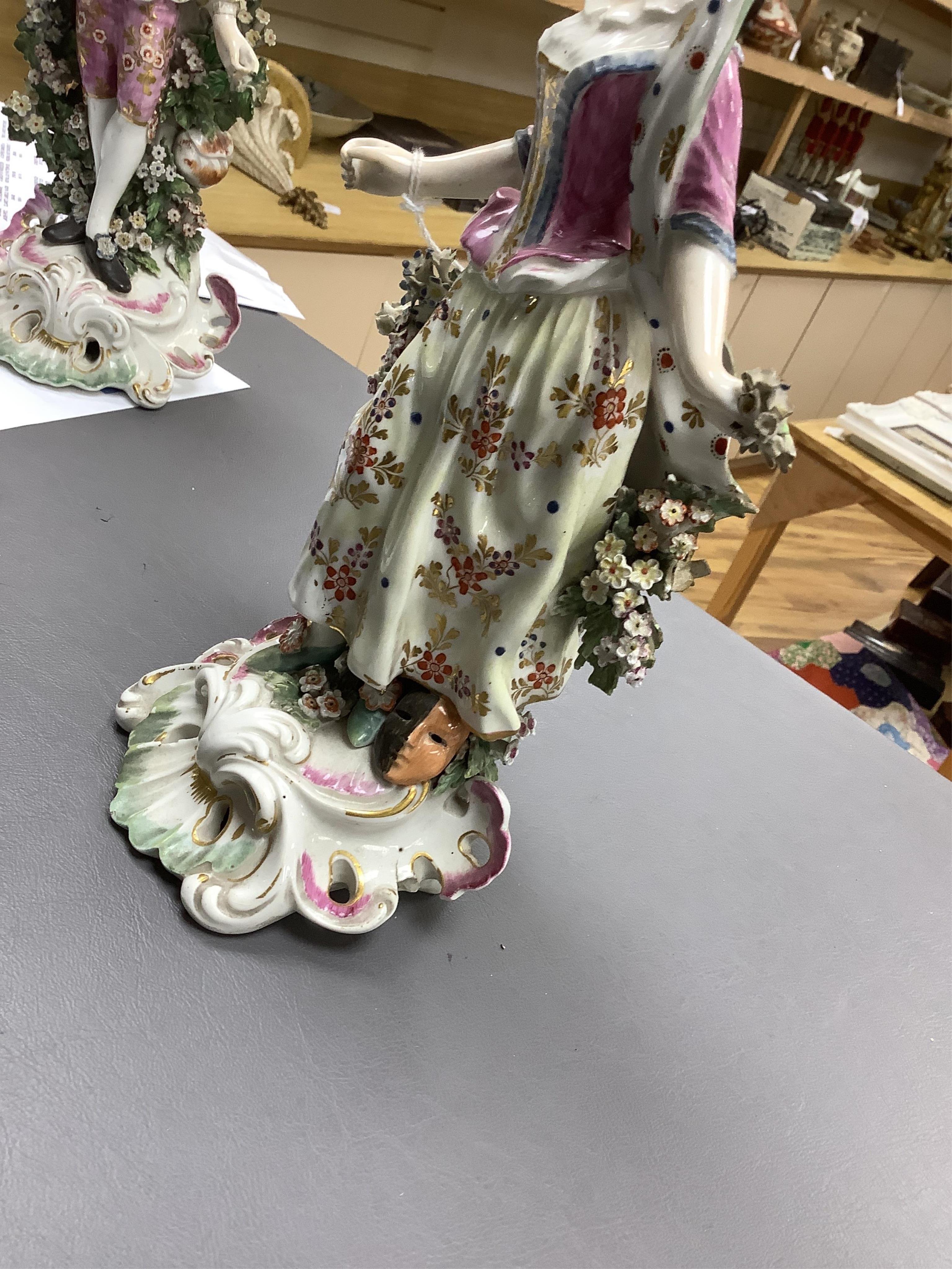 A pair of 18th century Derby porcelain figures of a lady and gentleman, 27cm high